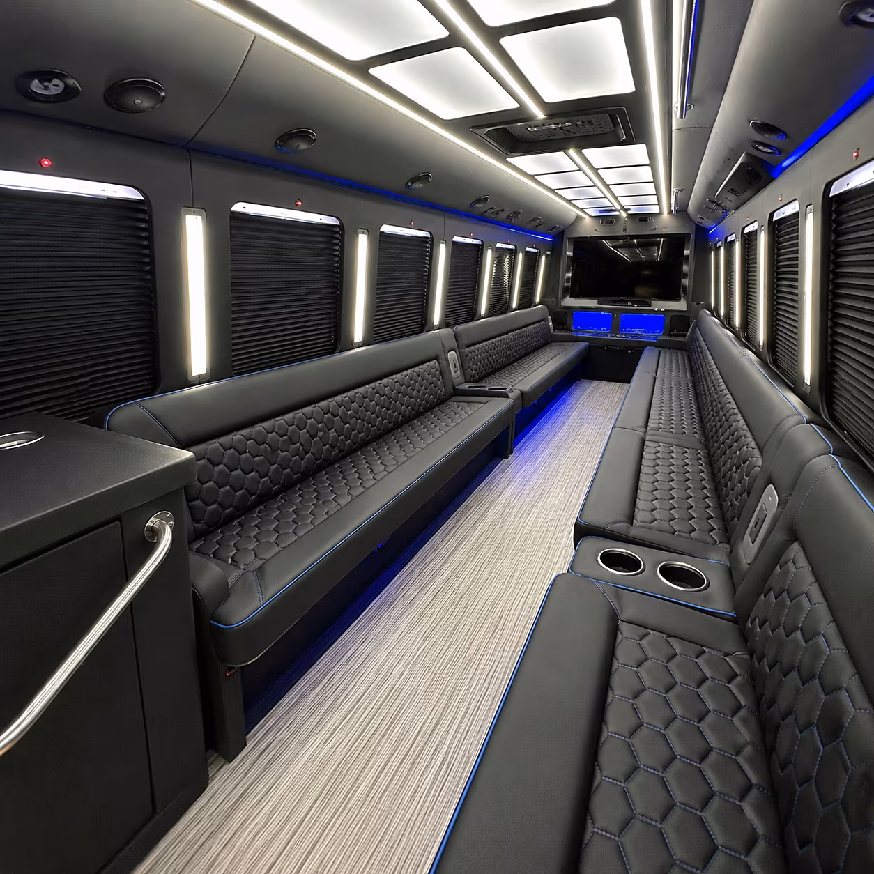 Friends laughing during a party bus celebration in Lincoln